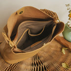 Tan leather coach purse shoulder bag with spacious interior and elegant design