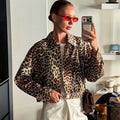 Cropped dad sherpa trucker jacket in leopard print for stylish layering