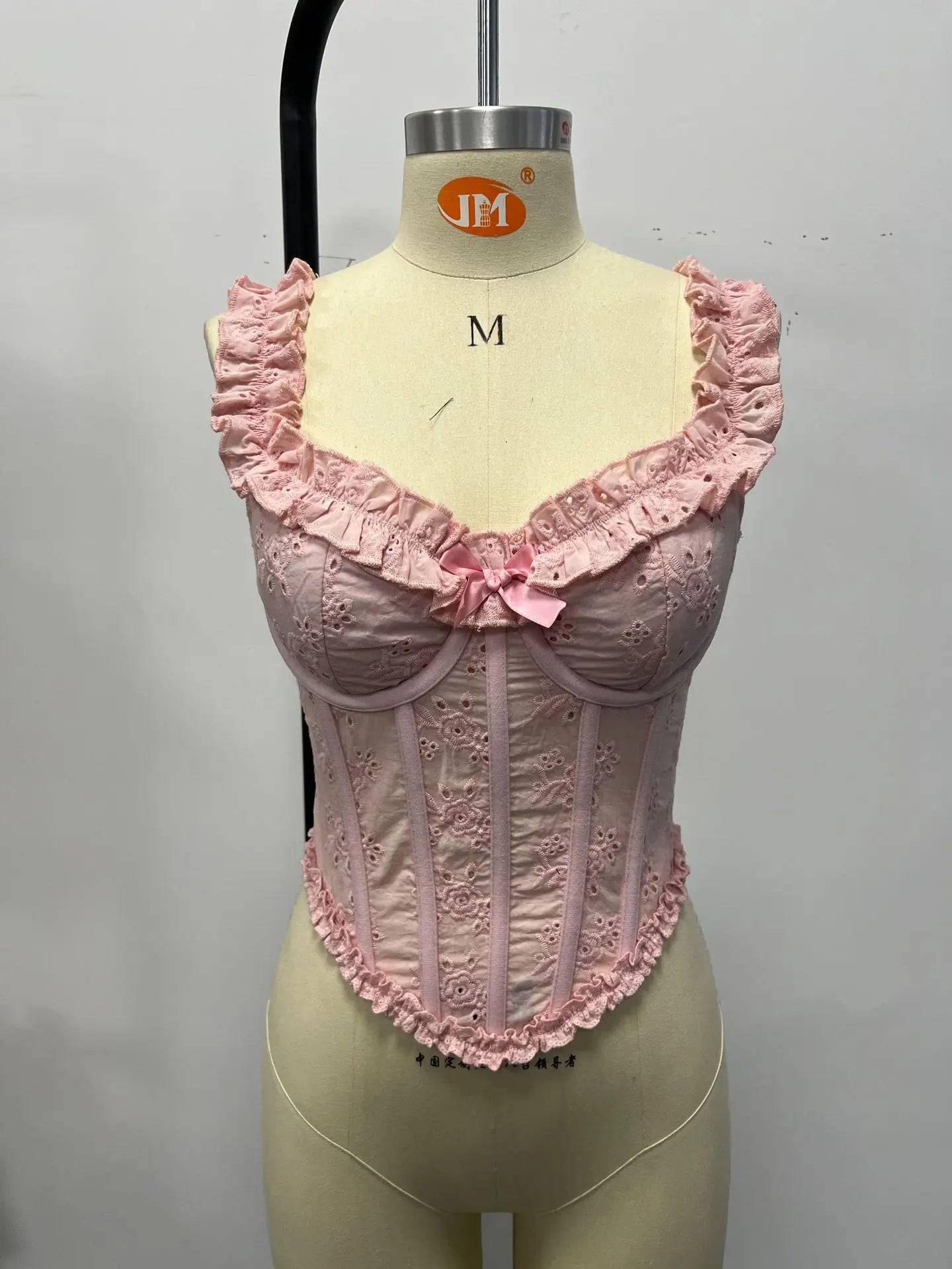 Pink ruffled cropped top for stylish women's summer outfits