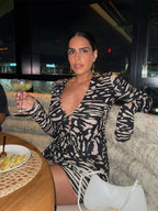 Women's mini dress in black and beige animal print, perfect for a night out