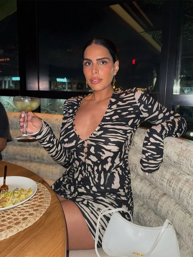 Women's mini dress in black and beige animal print, perfect for a night out