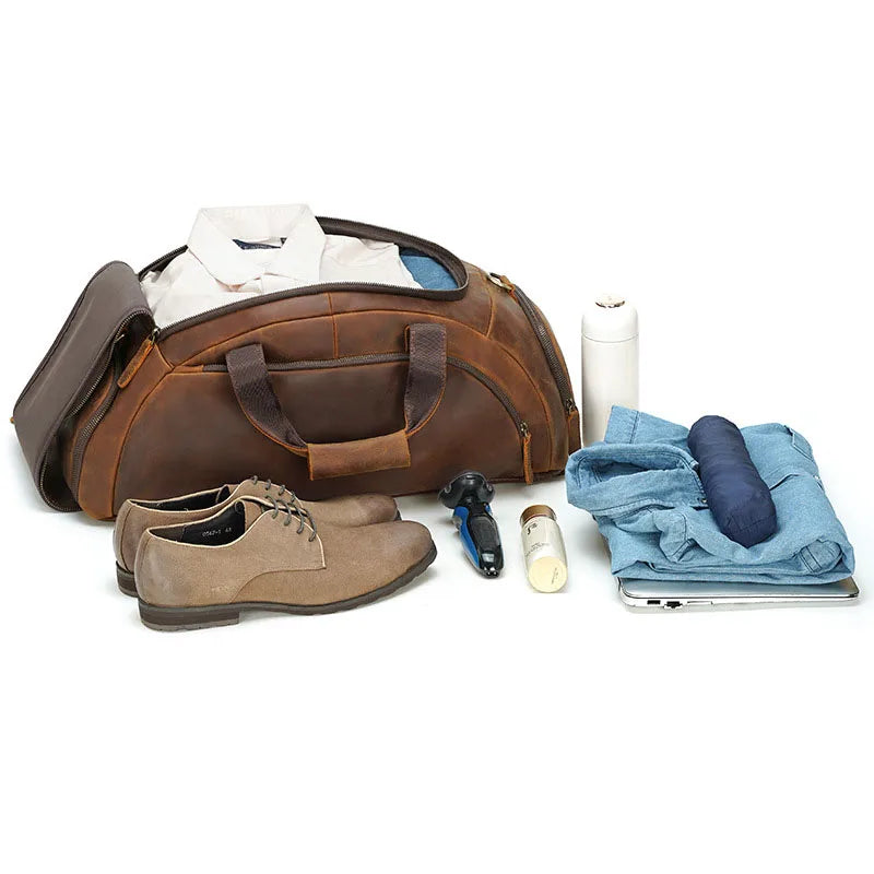 Brown leather duffle bag with shoes and travel essentials