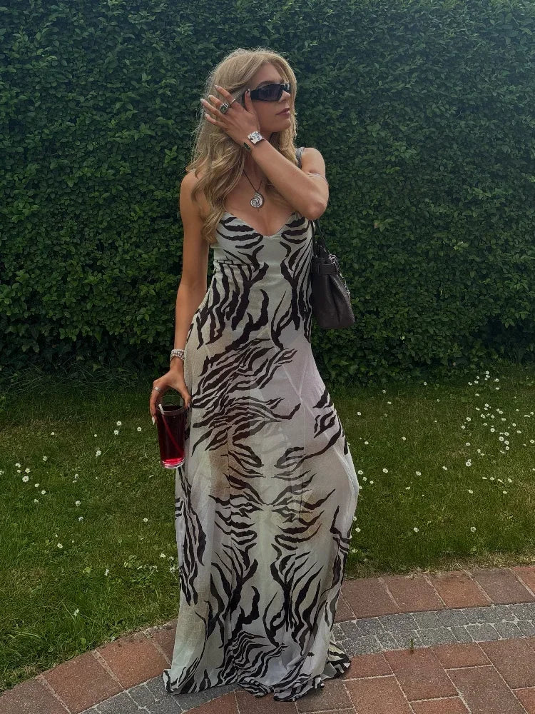 Women's sleeveless zebra print maxi dress, perfect for summer outings