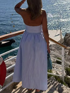 Blue and white striped strapless maxi dress, perfect for beach vacations