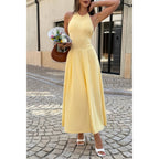 Yellow midi dress made of soft fabric, perfect for summer outings