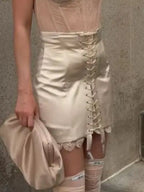 Women's satin mini skirt with lace-up front detail, stylish for nights out