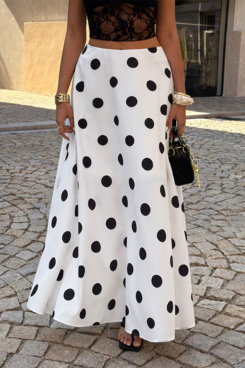 Women's white polka dot skirt, flowy fabric for stylish outings