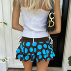 Women's pleated skirt in brown with blue polka dots, summer casual wear
