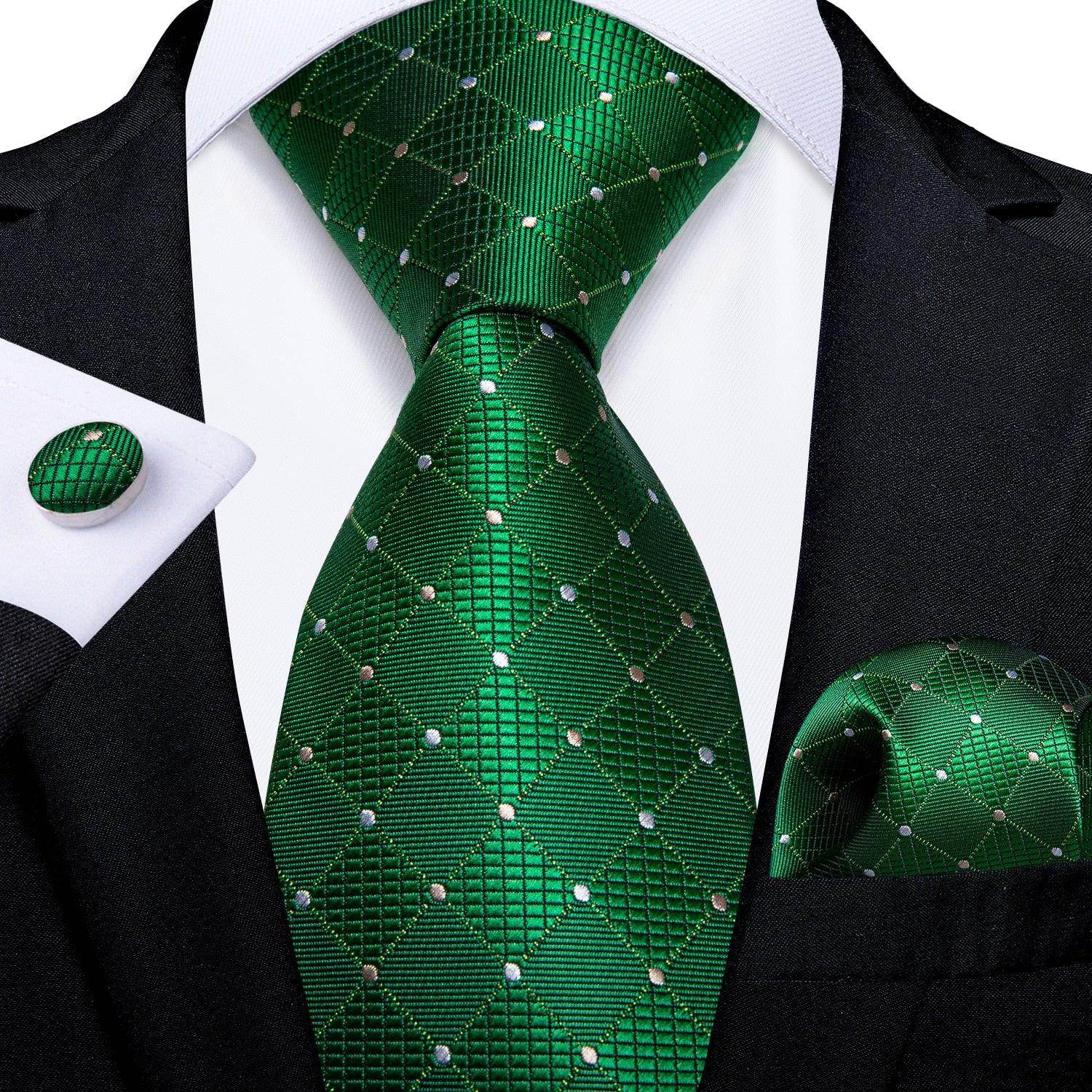 Teal blue paisley necktie showcased with matching pocket square and cufflink for men's formal wear
